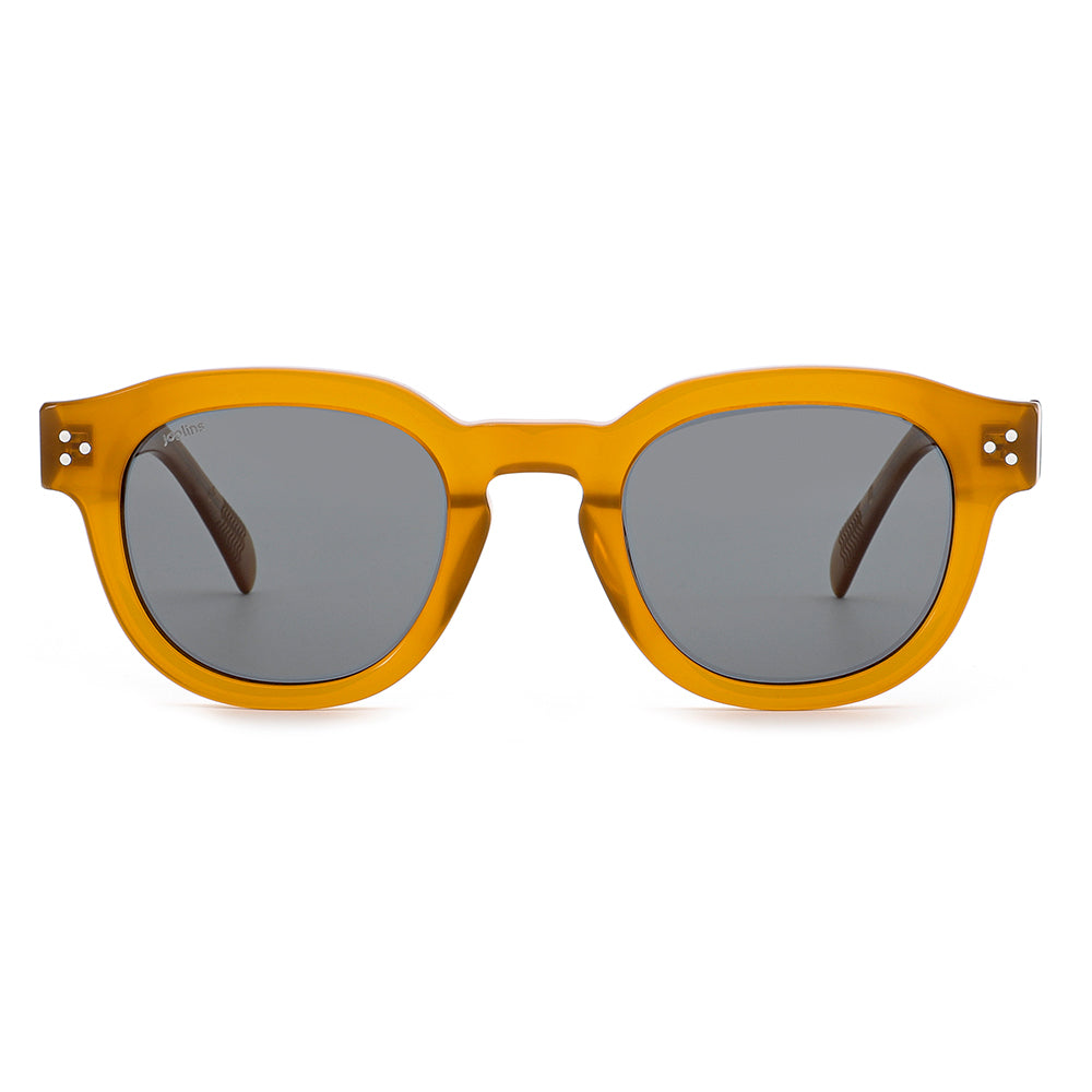 Yellow sunglasses with dark lenses on a white background
