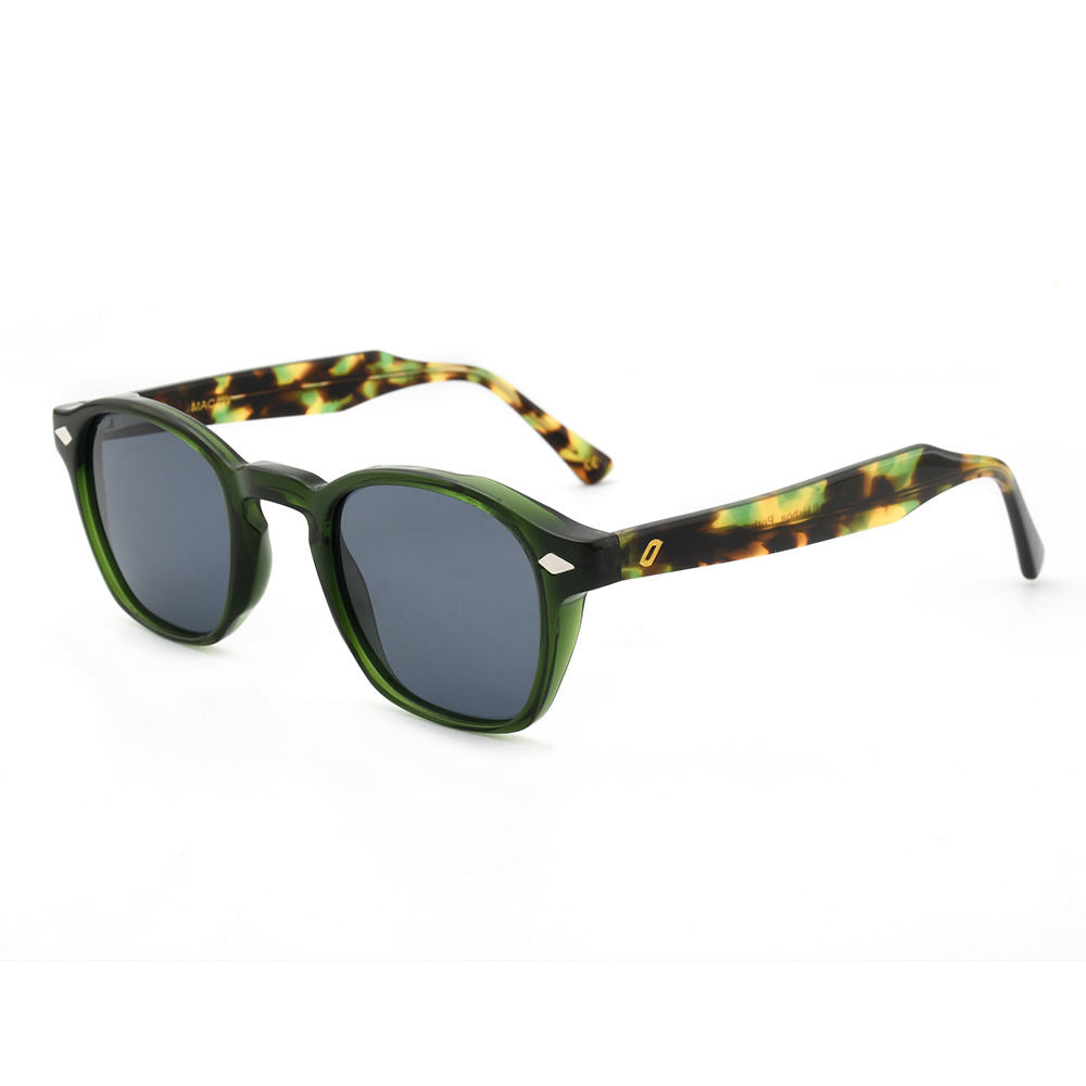 Sunglasses with green frame and tortoiseshell arms on a white background